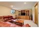 Finished basement with entertainment center and comfortable seating at 9350 Grandview Ave, Arvada, CO 80002