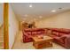 Finished basement offering a large sectional sofa and game table at 9350 Grandview Ave, Arvada, CO 80002