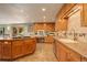 Modern kitchen with granite countertops and custom cabinetry at 9350 Grandview Ave, Arvada, CO 80002