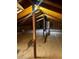 Unfinished attic space with plywood flooring and ample storage at 9350 Grandview Ave, Arvada, CO 80002