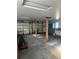 Attached garage with double doors, workbenches, and storage cabinets at 9350 Grandview Ave, Arvada, CO 80002