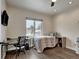 Bright bedroom with a cozy bed, built-in workspace, and plenty of natural light at 1516 Piney Hill Pt, Monument, CO 80132