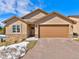 Ranch-style home with attached garage and landscaping at 1516 Piney Hill Pt, Monument, CO 80132