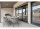 Covered patio with outdoor dining set and built-in grill at 8015 Parnassus Pl, Castle Rock, CO 80108