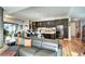 Modern kitchen with dark wood cabinets and a large island at 4200 W 17Th Ave # 235, Denver, CO 80204