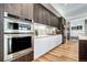 Modern kitchen with double oven and custom cabinetry at 4200 W 17Th Ave # 235, Denver, CO 80204