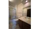 Bathroom with tub, shower, toilet, and vanity at 1754 S Troy St, Aurora, CO 80012