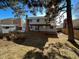 House exterior showcasing a two-story home with backyard at 1754 S Troy St, Aurora, CO 80012