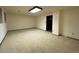 Finished basement with neutral carpeting and recessed lighting at 1754 S Troy St, Aurora, CO 80012