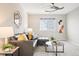 Comfortable living area with gray sectional sofa and a coffee table at 701 Boulder Peak Ave, Erie, CO 80516