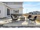 Concrete patio with seating area and fire pit at 701 Boulder Peak Ave, Erie, CO 80516