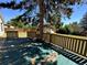 Backyard with deck, shed, and large tree at 3138 S Joplin Ct, Aurora, CO 80013