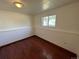 Basement bedroom with wood flooring and neutral walls at 3138 S Joplin Ct, Aurora, CO 80013