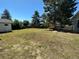 Large backyard with grassy area, playset, and deck at 3138 S Joplin Ct, Aurora, CO 80013