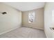 Simple bedroom with carpeted floors and a window at 10700 Kimblewyck Cir # 147, Northglenn, CO 80233