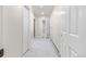 Bright hallway with access to multiple rooms and tiled floor at 3810 Urban St, Wheat Ridge, CO 80033