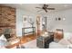 Spacious living room with hardwood floors and brick fireplace at 4303 Benton St, Denver, CO 80212