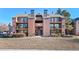 Brick building exterior with balconies and landscaping at 4899 S Dudley St # 7H, Littleton, CO 80123