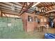 Barn interior with hay storage and additional stalls at 12154 Mesa View Rd, Larkspur, CO 80118