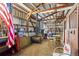 Barn interior with stalls, tack room, and seating area at 12154 Mesa View Rd, Larkspur, CO 80118