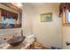 Small bathroom with copper sink and rustic decor at 12154 Mesa View Rd, Larkspur, CO 80118