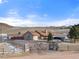 Ranch-style home on spacious lot with wooden fence and mountain views at 12154 Mesa View Rd, Larkspur, CO 80118