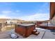 Relaxing hot tub on deck with scenic views of the surrounding area at 12154 Mesa View Rd, Larkspur, CO 80118
