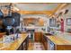 Kitchen with granite countertops, wooden cabinets, and a farmhouse sink at 12154 Mesa View Rd, Larkspur, CO 80118