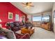 Spacious living room with leather furniture, large TV, and mountain views at 12154 Mesa View Rd, Larkspur, CO 80118
