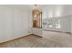 Dining room with carpet and view to the living room and kitchen at 496 Eldridge Ct, Golden, CO 80401