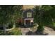 Two-story brick home with a front porch and landscaping at 638 S Lincoln St, Denver, CO 80209