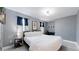 Spacious bedroom with a queen bed and a home office at 638 S Lincoln St, Denver, CO 80209