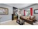 Living room with a fireplace and a brown leather sofa at 638 S Lincoln St, Denver, CO 80209