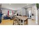 Open concept dining area and kitchen with wooden table and chairs at 638 S Lincoln St, Denver, CO 80209