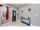 Kitchen features a back door, white cabinets and gray walls at 638 S Lincoln St, Denver, CO 80209