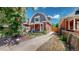 House exterior with a gabled roof and landscaped yard at 638 S Lincoln St, Denver, CO 80209