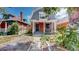Brick home with front porch and landscaped yard at 638 S Lincoln St, Denver, CO 80209