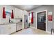 Modern kitchen with white cabinets, stainless steel appliances, and granite countertop at 638 S Lincoln St, Denver, CO 80209