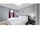 Cozy bedroom with a king-size bed and burgundy curtains at 638 S Lincoln St, Denver, CO 80209