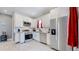 Modern kitchen with white cabinets, stainless steel appliances, and granite countertop at 638 S Lincoln St, Denver, CO 80209