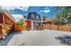 Large backyard with gravel and wooden fence at 638 S Lincoln St, Denver, CO 80209