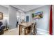Dining area with wooden table and chairs near kitchen at 638 S Lincoln St, Denver, CO 80209