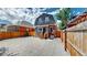 Backyard with gravel, wooden fence, and detached structure at 638 S Lincoln St, Denver, CO 80209