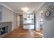 Modern hallway with built-in shelving and view into the kitchen at 210 Ivanhoe St, Denver, CO 80220