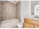 Bathroom with shower/tub combo and wood vanity at 14543 E 12Th Ave, Aurora, CO 80011