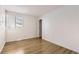 Bright bedroom with light walls and wood floors at 14543 E 12Th Ave, Aurora, CO 80011