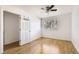 Simple bedroom with wood floors and a closet at 14543 E 12Th Ave, Aurora, CO 80011