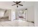 Living area with tiled floors, sliding glass doors and staircase at 14543 E 12Th Ave, Aurora, CO 80011