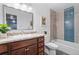 Updated bathroom with granite vanity and blue tile shower at 955 Eudora St # 1008, Denver, CO 80220