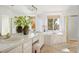 Elegant bathroom with double vanity, soaking tub, and large window at 4340 Nelson Dr, Broomfield, CO 80023